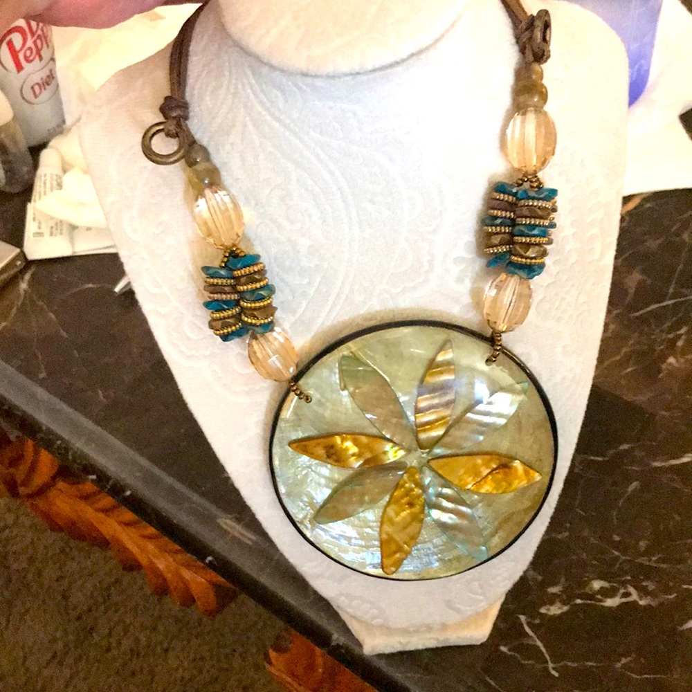 Nice necklace.  Looks great with olive green.